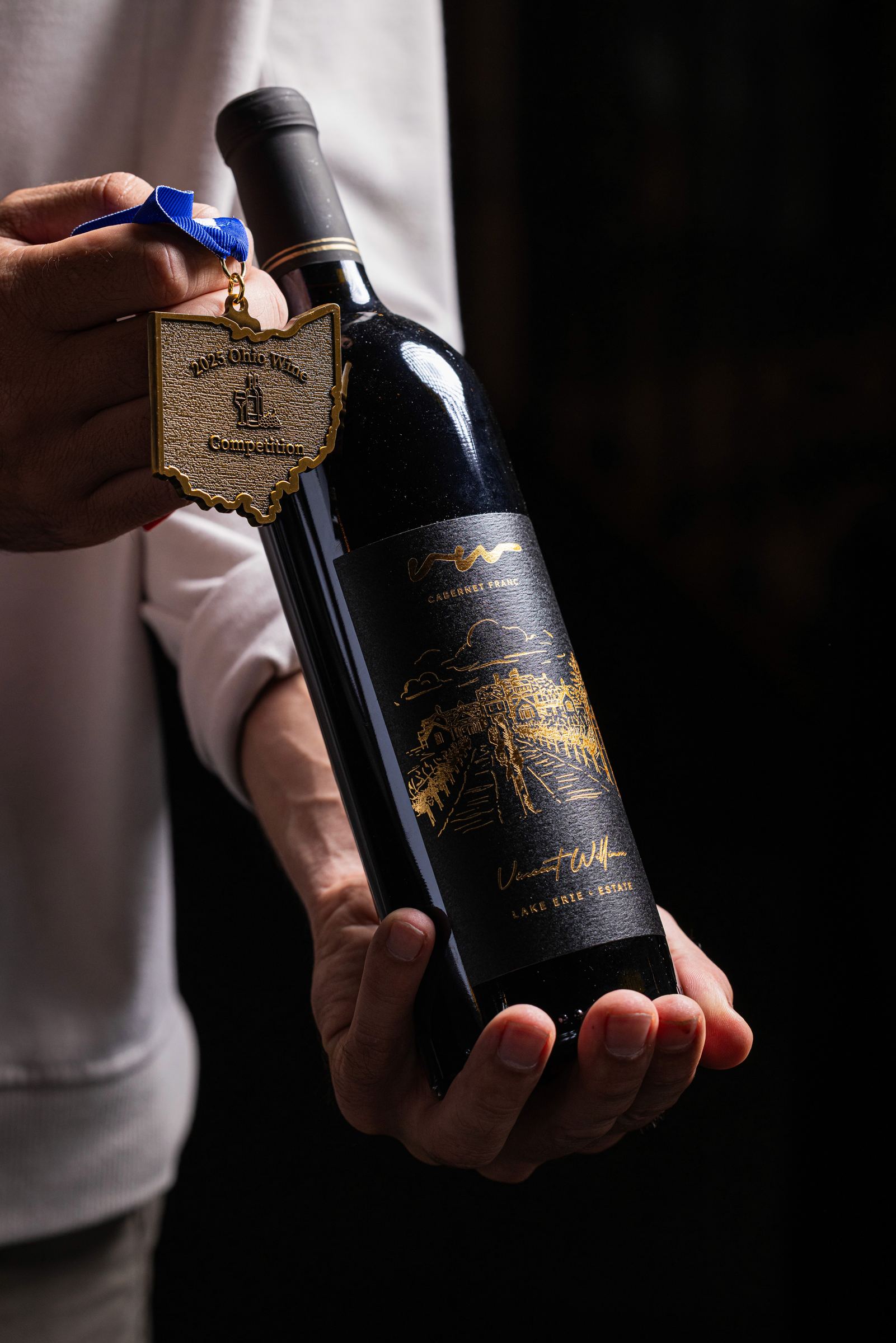 A bottle of wine being poured at Vincent William Wine