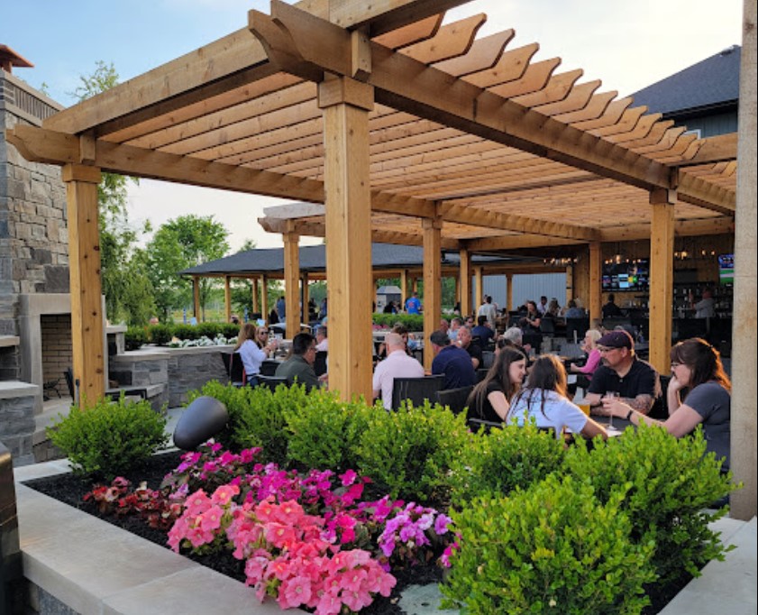 Baci’s outdoor seating beneath the pergola