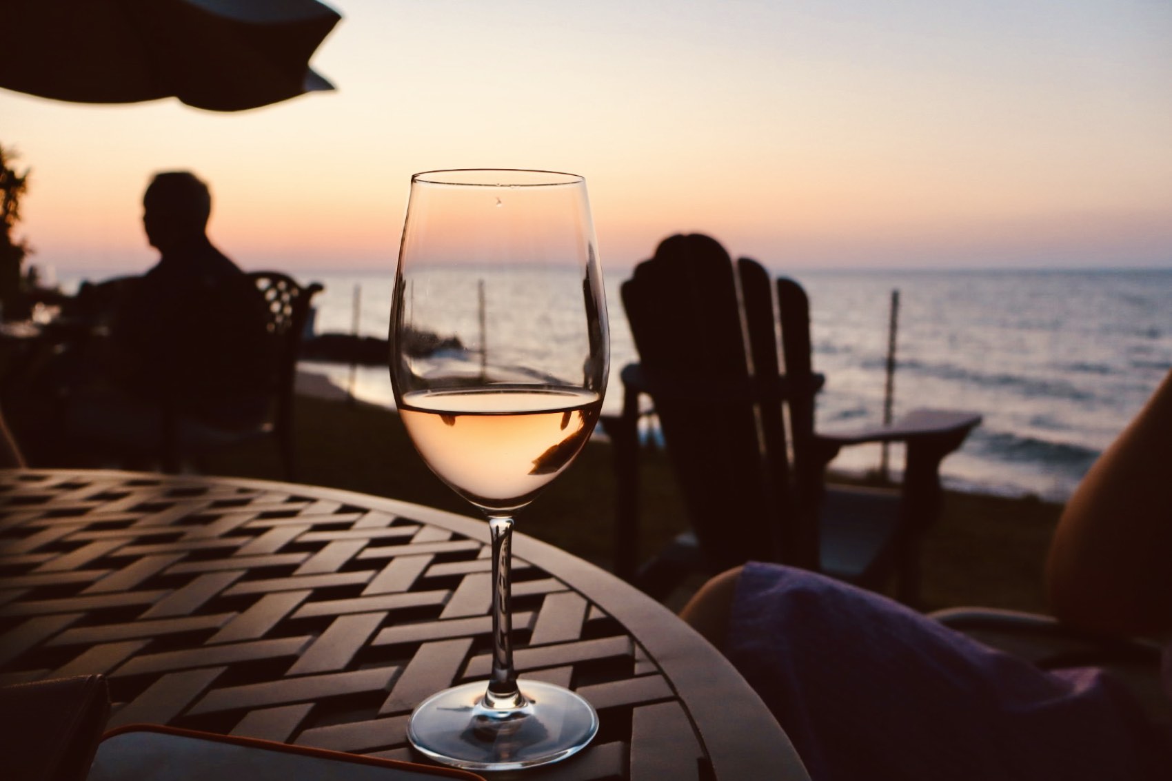 A glass on the lawn above the beach